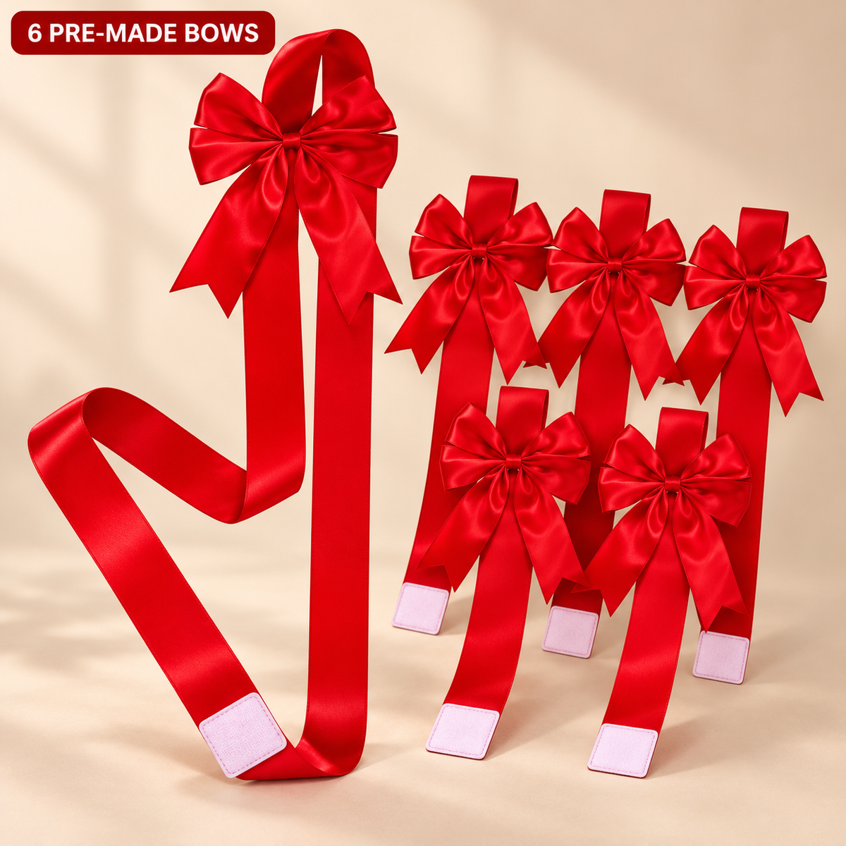Six red satin pre-made cabinet bows with one long ribbon and its hook-and-loop tab on a warm beige background.