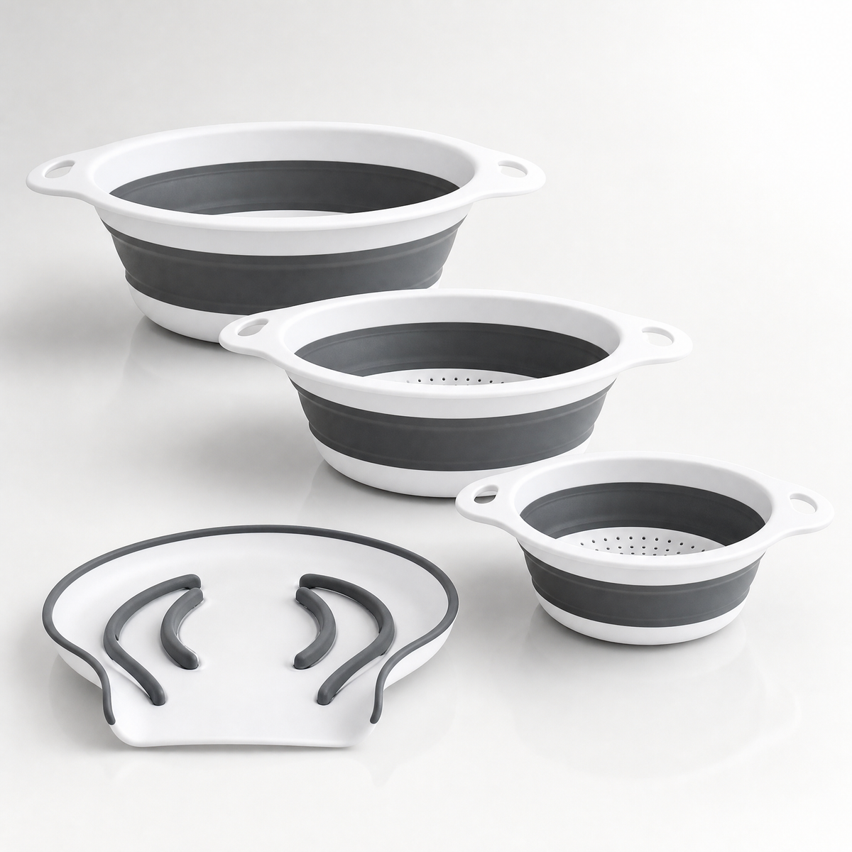 The four-piece collapsible colander set arranged on a clean studio background.