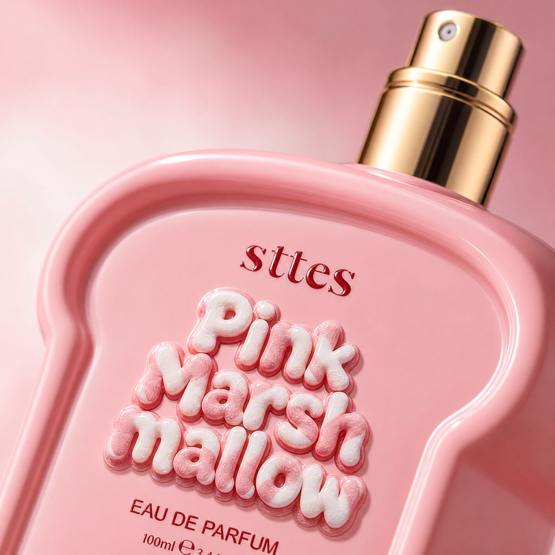 Macro close-up of the gold nozzle and puffy Pink Marshmallow lettering on the pink bottle.