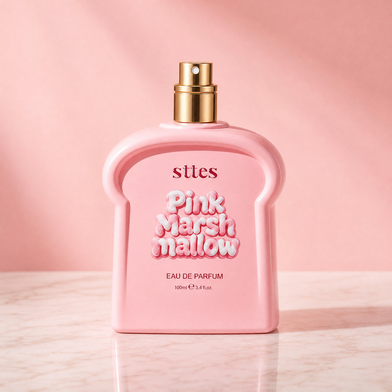 The pink marshmallow perfume bottle alone on a marble vanity against a soft pink backdrop.