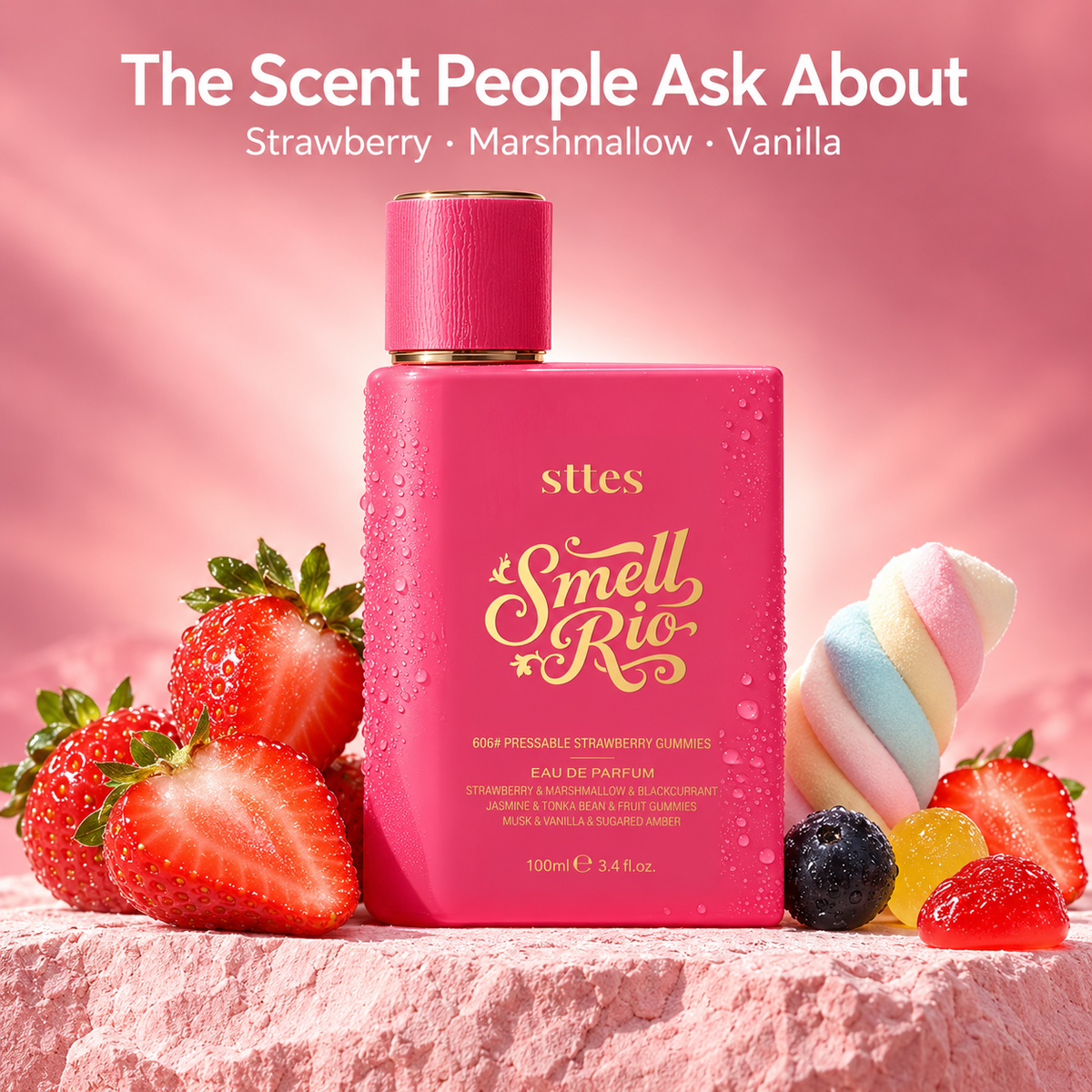 The pink Strawberry Gummies eau de parfum bottle on a stone ledge with strawberries and marshmallows under the headline The Scent People Ask About.
