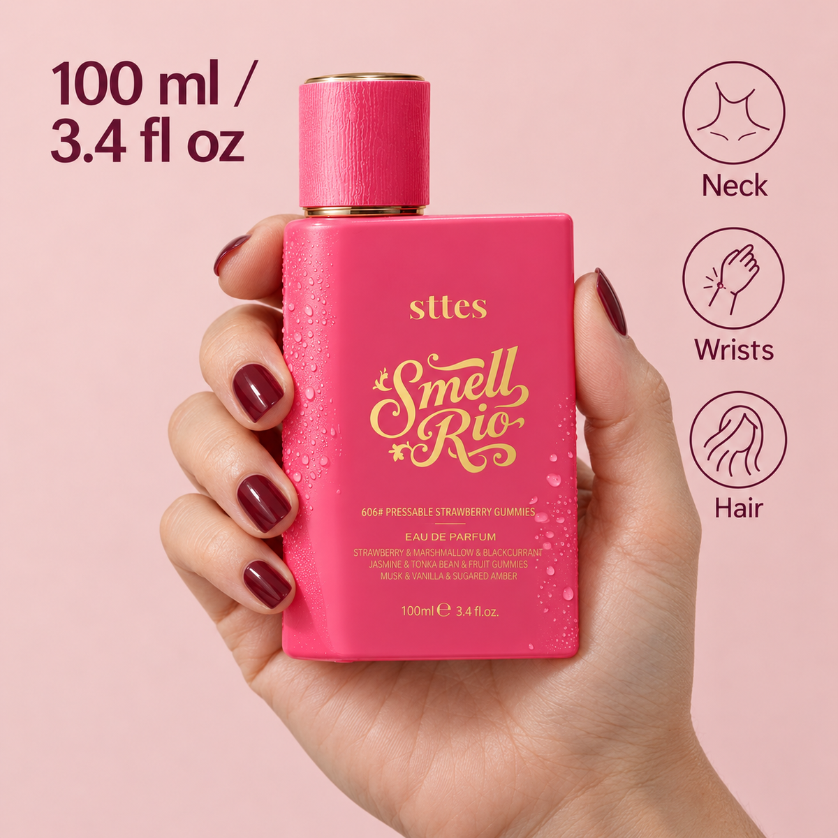 A hand holds the 100 ml pink perfume bottle to show its size, with labels for spraying on neck, wrists and hair.
