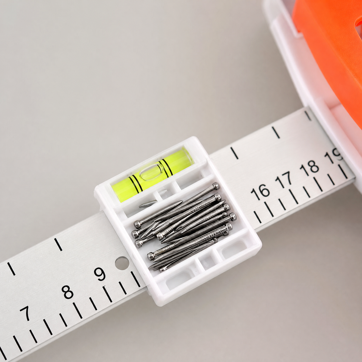 Macro close-up of the tool's centered bubble level and printed ruler numbers.